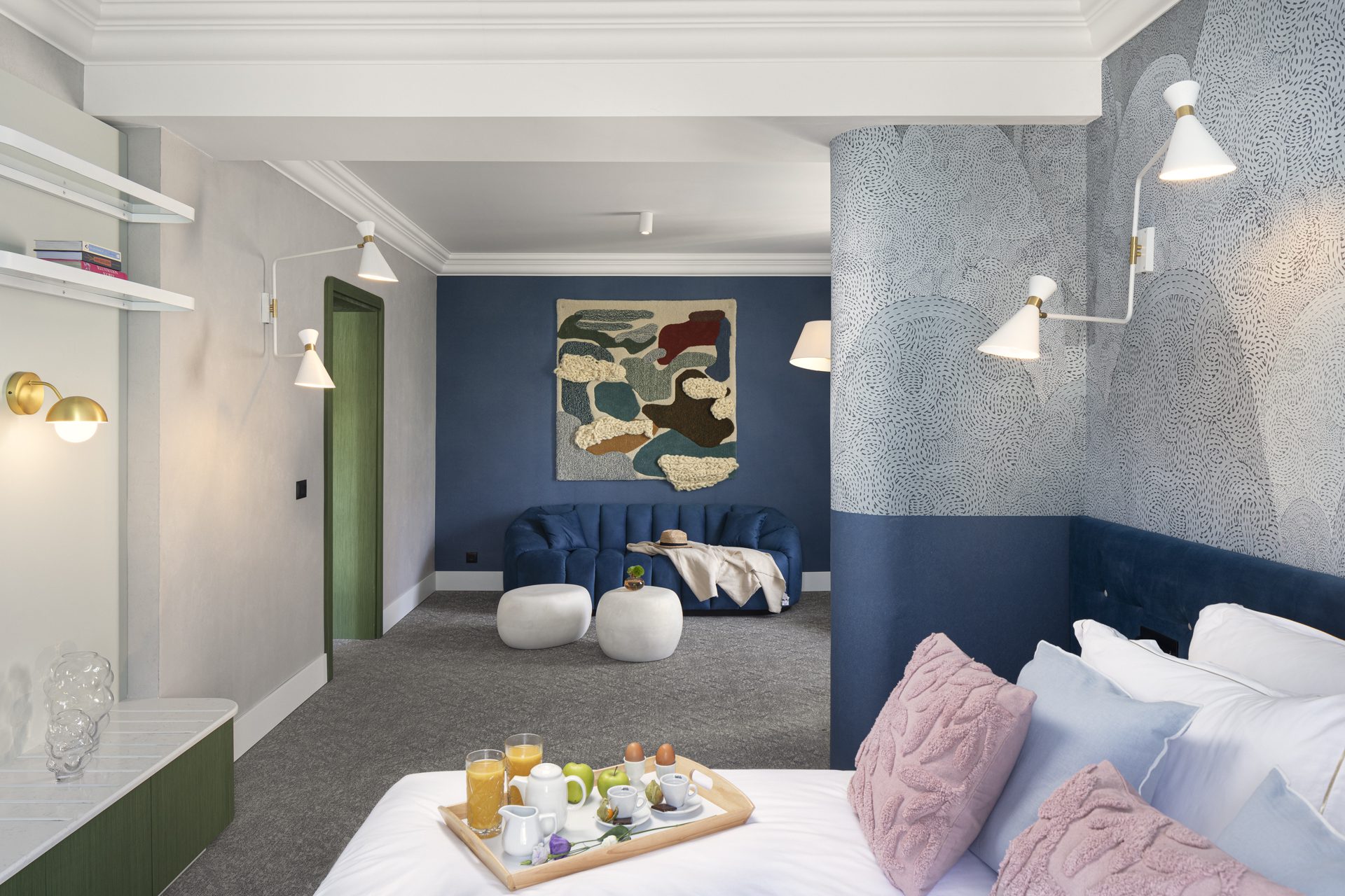 Luxurious hotel room interior with blue and white decor at Oborishte 63 Hotel in Sofia, Bulgaria